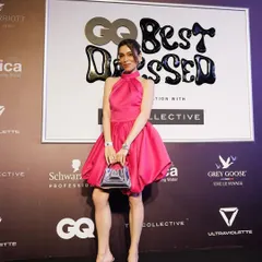 On the black carpet at the GQ Best Dressed event. The chic messy bun and glowing makeup created a look that was confident, stylish, and perfectly suited for a high-fashion party.