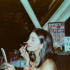 A candid film photo of me getting ready at a glitter bar. It’s all about the details and getting into the spirit of the party.