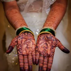 The final stain is just as important as the design itself. This is the deep, reddish-brown color my clients get from my all-natural, organic henna paste after following my aftercare tips. This bridal design also features custom portraits of the couple.
