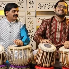 This is a cherished moment with my appa and guru, Pandit Rajgopal Kallurkar. Learning from him is the greatest blessing, as this art is a legacy passed down through my family. We are seen here in a tabla duet setting.