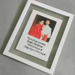 My bestseller, the floating acrylic frame. I take your favorite photo and pair it with a handwritten message, creating a beautiful illusion that your memory is suspended in air. It's a modern and meaningful way to celebrate an anniversary or any special moment.
