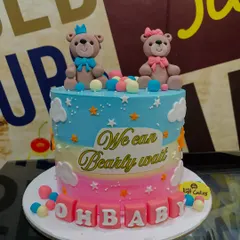 A 3kg "We Can Bearly Wait" baby shower cake with a gender-neutral rainbow design and two teddy bear toppers.