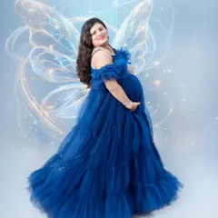 Celebrating the magic of motherhood. For this maternity shoot, we added ethereal fairy wings to a beautiful flowing gown, transforming a simple portrait into a fantasy. I love working with moms-to-be to create images that reflect their inner glow.