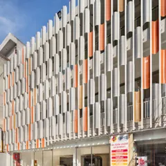 The SPS Hospital Clinic is a forward-thinking prototype designed for brand consistency and replicability. The vibrant, perforated facade is a recognizable identity marker that also responds sensitively to Ludhiana's subtropical climate.