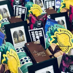 A closer look at the contents of our "Groom Squad" hampers. We include a mix of fun and practical items like face masks, snacks, a personalized photo frame, and a stylish mug.