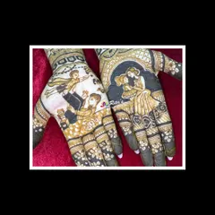 A close-up of the beautiful family portraits on the palms. This is a wonderful way to include older siblings in the celebration.