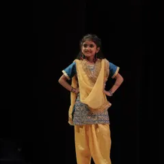 A 'Dancing Divaa' strikes a pose during her performance. Our traditional dance classes for kids are a great way to connect with culture.