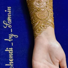 A delicate wrist cuff design for an engagement, featuring a central rose motif.
