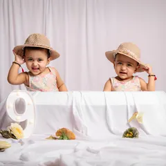 Celebrating nine months with an adorable twin photoshoot. We love marking these special milestones as your babies grow and their personalities emerge.