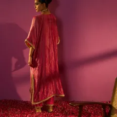 The back view of the crushed-fabric kaftan from the Kashidaa editorial. This shot was intentionally composed to highlight the garment's texture and drape, emphasizing the quiet luxury and craftsmanship of the piece.