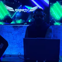 In the zone under the blue lights, with my 'Rebirth' logo on the screen. The club is my sanctuary, where I can be in my element and connect with the crowd through music.