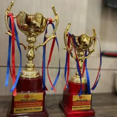 The trophies from the MT400 tournament in Solapur, representing a singles win and a doubles runner-up finish. The journey of hard work and competition continues.