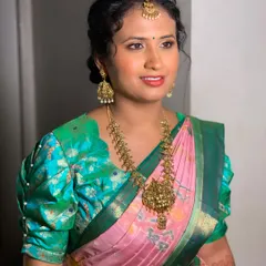 A different angle of Swathi's guest makeup look, showing the soft makeup and curly updo.