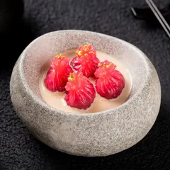 A more modern plating of dim sum in a stone bowl. This shows versatility in styling, from traditional to contemporary, for the same client.