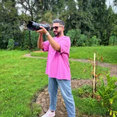 Me in my element, lining up a shot during an outdoor session. Finding the perfect composition is key.