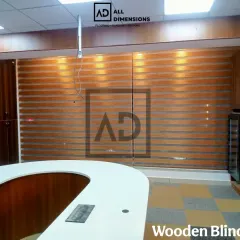 This is another example of wooden zebra blinds in a commercial setting. They provide a professional and warm atmosphere for this reception area while offering practical light management for the staff.