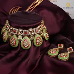 A close-up of one of my favorite Kundan and Meenakari sets. The vibrant green and red enamel work is entirely handcrafted, offering a regal look that is perfect for brides who want a touch of unique color.