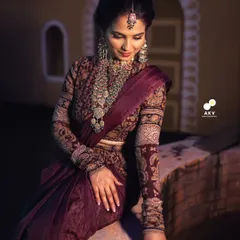A closer look at the makeup for our traditional photoshoot. I used earthy tones on the eyes and a warm, radiant base to complement the deep burgundy of the outfit and the intricate silver jewelry, creating a cohesive and regal look.