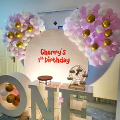 Another example of the "ONE" marquee letters, here used for "Cherry's 1st birthday" with pink and gold Mickey-ear balloon clusters.