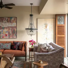 We designed this Calcutta living room to feel like a warm embrace. It’s a space layered with textures and memories, from the vintage-inspired furniture and rich upholstery to the carefully chosen art. The elegant chandelier adds a touch of old-world charm, creating a perfect setting for a family that loves to gather and share stories.