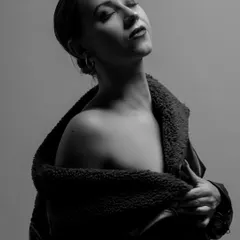 I love the quiet power of black and white. This monochrome portrait focuses on pure emotion, using soft, directional light to sculpt the subject's features and create a timeless, introspective mood.