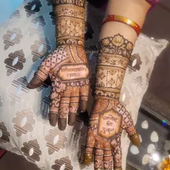 This semi-bridal design was for a client's 25th wedding anniversary and includes their names beautifully written on each palm.