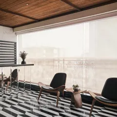 For this balcony, I designed a space that could be enclosed with a retractable screen, making it usable year-round. The custom black and white marble flooring is reflected in the mirrored bar counter, making the area feel expansive and luxurious.