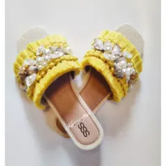 Another look at the seashell-adorned macrame slippers. These were customized for a bride's haldi ceremony and are perfect for a beach wedding or holiday.