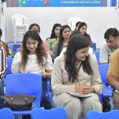 Parents attentively listening and taking notes during our orientation program. We believe in open communication and partnership with parents to support each child's learning journey.