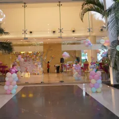 A wide view of the Unicorn party venue, showing the entrance decor and the main stage, creating an immersive experience for guests from the moment they arrive.