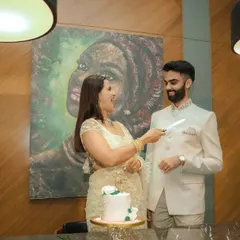 The cake cutting ceremony at an engagement party. This is a classic moment, and I capture it candidly to preserve the genuine smiles and excitement.