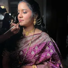 A candid shot of me applying lipstick on a bride. Every detail matters for the perfect finish.