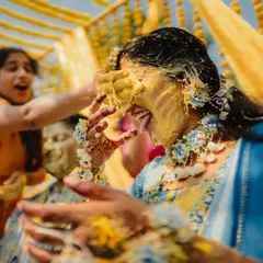 The pure, uninhibited joy of a Haldi ceremony. We live for these candid moments, getting right into the action to capture the real laughter and playful chaos. This shot is all about raw energy and celebration.