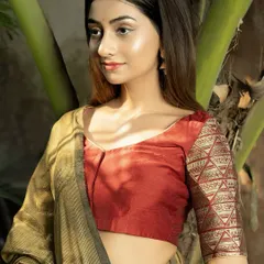 Bold in maroon, regal in gold. This blouse, with its rich maroon body and contrasting gold brocade sleeves, is designed for weddings and festive occasions where you want to shine.