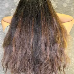 The "before" shot of long hair, ready for a wine red balayage transformation.