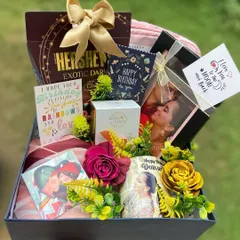 We created this luxurious birthday hamper for a client's wife, and it’s filled with personal touches. It includes a custom photo mug, a stylish scarf, premium Hershey's dark chocolate, Body Cupid perfume, and multiple heartfelt birthday cards, all arranged beautifully in a keepsake box.