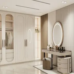 Here, the walk-in closet includes an integrated vanity. The backlit oval mirror and dedicated drawers create a perfect spot for self-care, seamlessly blending the wardrobe and dressing area into one cohesive, functional space.