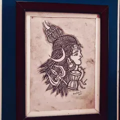 A profile drawing of Lord Shiva, incorporating zentangle patterns into his hair and ornaments. This A4 piece comes in a brown frame.