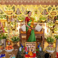 We honor timeless traditions with a touch of rustic elegance. This Seemantham (baby shower) setup features intricate floral arrangements, brass lamps, and peacock details to create a blessed and beautiful celebration.