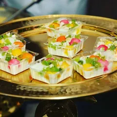 A platter of our fusion Bengali sweets. These colorful, bite-sized treats combine traditional flavors with modern presentation, making the wedding buffet look versatile and lip-smacking.