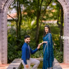 A classic proposal pose in a beautiful garden setting. The archway and fountain create a timeless and romantic backdrop for this special moment.