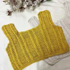 A beautiful example of our textured stitch work. This handmade sleeveless crop top in a bright yellow is perfect for a sunny day out.
