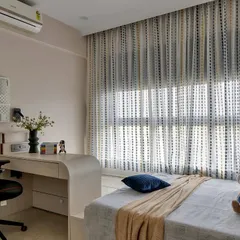 A cozy and modern retreat for a child, this room perfectly blends relaxation and productivity. It features a comfortable bed, a sleek study desk with an ergonomic chair, and soft, natural lighting from the large window.