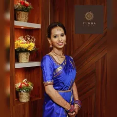 A happy client, Mala, looking stunning in a royal blue silk saree paired with a custom embroidered blouse I designed for her.
