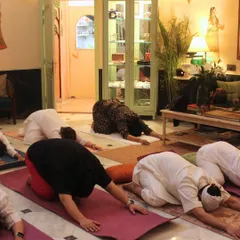 Students in child's pose during our Jaipur retreat. The beautiful, traditional Rajasthani interior adds to the serene and grounding atmosphere of the practice.