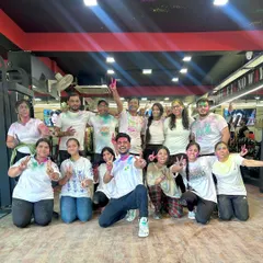 A happy, colorful group shot after our Holi Zumba party. These smiles say it all. We believe in celebrating every moment together.