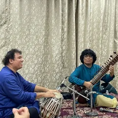A moment of musical conversation during an intimate recital. Here, I am performing with Satyajit Talwalkar on tabla, exploring the nuances of the raag for an appreciative audience.
