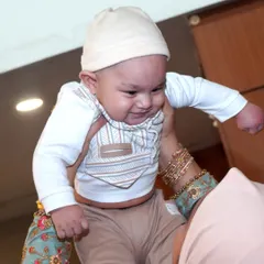 The pure joy of a baby being lifted in the air. These are the spontaneous, love-filled moments between parents and children that make the most precious memories.