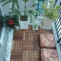 This is another example of how wooden deck tiles can completely transform a balcony. Paired with some comfortable cushions and potted plants, it becomes a cozy and inviting outdoor nook.