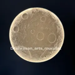 A close-up shot of a completed moon mural. You can really see the detail and texture of the hand-sculpted craters. The integrated lighting gives it a soft, ethereal glow.